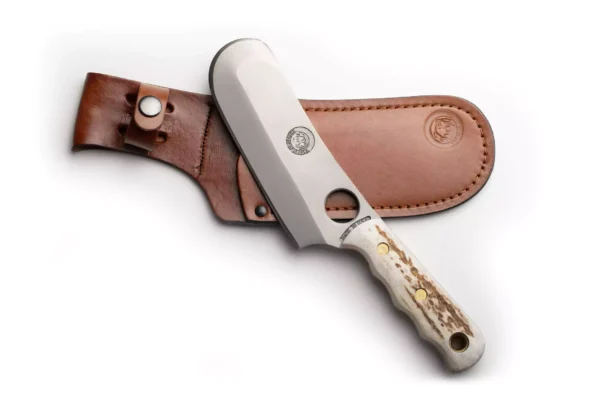 Knives of Alaska Brown Bear knife with stag handle resting on leather sheath
