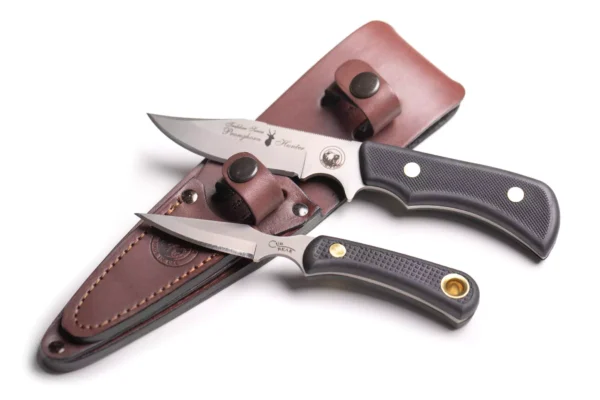 Trekker Pronghorn and Cub Bear knife combo with Suregrip handles displayed with a leather sheath.