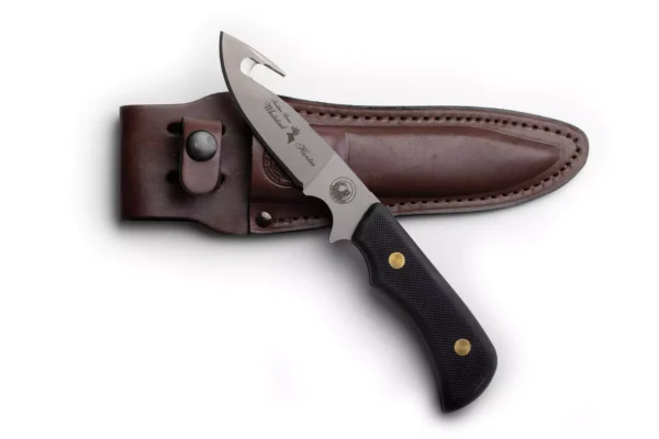 Trekker Whitetail knife with black Suregrip handle and leather sheath.