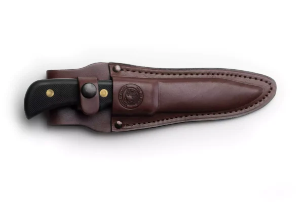 Trekker Whitetail knife with Suregrip black handle secured in brown leather sheath.