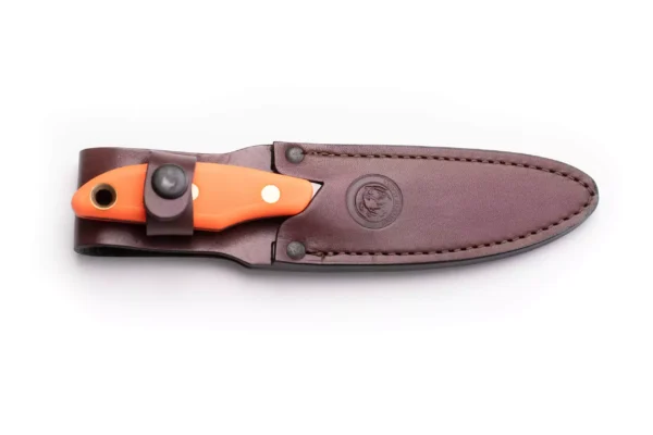 Knives of Alaska Yukon #1 knife secured in brown leather sheath, featuring an orange SureGrip handle and D2 tool steel construction.