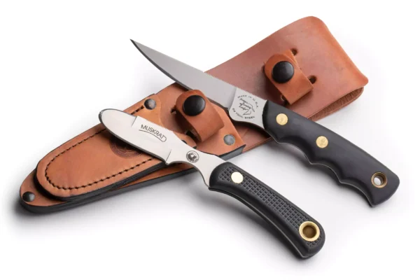 Knives of Alaska Jaeger and Muskrat knife set with black Suregrip handles and leather sheath.